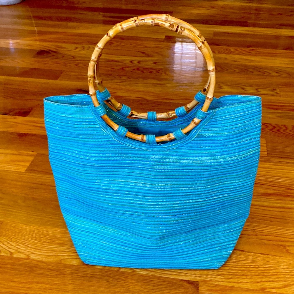 Woven bag with cane handles